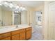 Bathroom with double sinks, framed mirrors, and a walk-in shower is seen through the door at 795 Saddle Ridge Trce, Roswell, GA 30076