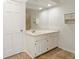 Bathroom featuring a white vanity cabinet, spacious countertop, and large framed mirror at 795 Saddle Ridge Trce, Roswell, GA 30076