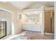 A light-filled bathroom features a vanity with double sinks, shower, and soaking tub near a window at 795 Saddle Ridge Trce, Roswell, GA 30076