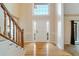 Bright foyer with hardwood floors, wainscoting, and a staircase at 795 Saddle Ridge Trce, Roswell, GA 30076