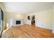 Bright living room features hardwood floors, a fireplace, and access to another room at 795 Saddle Ridge Trce, Roswell, GA 30076