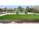 View of the community playground with green slides and soft turf at 795 Saddle Ridge Trce, Roswell, GA 30076