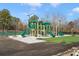 View of the community playground with green slides and soft turf at 795 Saddle Ridge Trce, Roswell, GA 30076