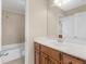 Bathroom featuring a vanity with wood cabinets, a tub-shower combo with tiled walls, and tile flooring at 8116 Powhattan Ct, Mcdonough, GA 30252