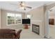 Relaxing main bedroom sitting area featuring a fireplace and large windows at 8116 Powhattan Ct, Mcdonough, GA 30252