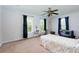 Bright bedroom featuring two windows, ceiling fan, and ample space for desk and crib at 106 Lanyard Bnd, Peachtree City, GA 30269