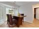 Bright dining area featuring large window, wooden table, and neutral wall paint at 106 Lanyard Bnd, Peachtree City, GA 30269