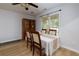 Cozy dining room with natural light, wood flooring, and inviting atmosphere for Gathering meals at 106 Lanyard Bnd, Peachtree City, GA 30269