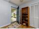 Well-lit entryway featuring a shoe rack, coat closet, and an open door to the porch at 106 Lanyard Bnd, Peachtree City, GA 30269