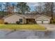 Charming single-story home with a well-manicured lawn and a two-car garage at 106 Lanyard Bnd, Peachtree City, GA 30269
