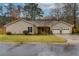 Charming single-story home featuring a well-maintained lawn, attached two-car garage, and inviting curb appeal at 106 Lanyard Bnd, Peachtree City, GA 30269