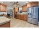 Well-equipped kitchen featuring stainless steel appliances, and ample cabinet space at 106 Lanyard Bnd, Peachtree City, GA 30269