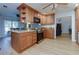 Stylish kitchen with stainless steel appliances, laminate floors, and an island counter at 106 Lanyard Bnd, Peachtree City, GA 30269