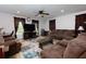 Spacious living room has recessed lighting, ceiling fan, two large windows, and plush seating at 106 Lanyard Bnd, Peachtree City, GA 30269