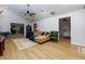 Bright and airy living room with wood flooring and comfortable seating, perfect for relaxing or entertaining at 106 Lanyard Bnd, Peachtree City, GA 30269
