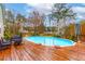 Inviting backyard pool area with a spacious deck and comfortable seating for relaxing or entertaining at 106 Lanyard Bnd, Peachtree City, GA 30269