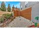 Private backyard featuring a gravel area with a modern wooden fence and lush landscaping at 108 Rex Ave, Canton, GA 30114