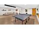 Finished basement with ping pong table, modern sectional, and rustic barn door at 108 Rex Ave, Canton, GA 30114