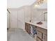 Bathroom with a dual sink vanity, modern light fixtures and spacious open shower at 108 Rex Ave, Canton, GA 30114
