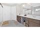 Bathroom with double sinks, white countertops, and tile floors, creating a modern space at 108 Rex Ave, Canton, GA 30114