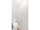 Simple bathroom featuring a toilet, light walls, and essential fixtures at 108 Rex Ave, Canton, GA 30114