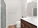 Bathroom with a shower, modern vanity, and neutral paint at 108 Rex Ave, Canton, GA 30114