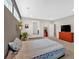 Bright bedroom featuring a bed, red dresser, and doorway access to other rooms at 108 Rex Ave, Canton, GA 30114