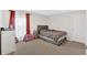 Bedroom with large window, carpet flooring, a small pink lounge, and neutral decor at 108 Rex Ave, Canton, GA 30114