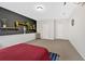 Spacious bedroom with light gray walls, art decor, and a mounted basketball hoop at 108 Rex Ave, Canton, GA 30114