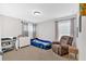 Bright bedroom features carpet floors, a large chair, and a fun race car bed at 108 Rex Ave, Canton, GA 30114