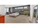 Spacious bedroom featuring a decorative wall and floating shelves with plants, creating a serene and stylish retreat at 108 Rex Ave, Canton, GA 30114