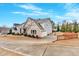 Charming home featuring brick and siding accents, a well-manicured lawn, and a driveway with basketball hoop at 108 Rex Ave, Canton, GA 30114