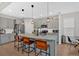 Modern kitchen featuring a large island, stainless steel appliances, and stylish pendant lighting at 108 Rex Ave, Canton, GA 30114