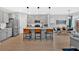 Kitchen with an island, stainless steel appliances, pendant lights, and attached dining table at 108 Rex Ave, Canton, GA 30114