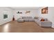 Bright living room with hardwood floors, large sectional sofa, and stylish wall decor at 108 Rex Ave, Canton, GA 30114