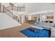 Open-concept living room with kitchen view, hardwood floors, and great natural light at 108 Rex Ave, Canton, GA 30114