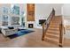 Spacious living room with a fireplace, high ceilings, large windows, and hardwood floors at 108 Rex Ave, Canton, GA 30114