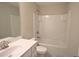 Well-lit bathroom with a tub/shower combo and neutral finishes at 680 Mason Grove Pkwy, Lawrenceville, GA 30043