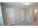 Bedroom with two closets with carpeted floors at 680 Mason Grove Pkwy, Lawrenceville, GA 30043