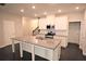 Well-lit kitchen boasting granite countertops and stainless steel appliances at 680 Mason Grove Pkwy, Lawrenceville, GA 30043