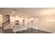 Open kitchen design with island, stainless appliances, and white cabinetry at 680 Mason Grove Pkwy, Lawrenceville, GA 30043