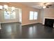 Bright living room with fireplace, hardwood floors, and abundant natural light at 680 Mason Grove Pkwy, Lawrenceville, GA 30043