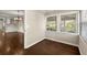 Bright breakfast nook with hardwood floors and windows, situated adjacent to the kitchen at 541 Hickory Sw Dr, Marietta, GA 30064