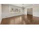 Dining room with wainscoting, chandelier, large windows and hardwood floors at 541 Hickory Sw Dr, Marietta, GA 30064