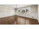 Dining room featuring a chandelier, wainscoting, large windows and hardwood floors at 541 Hickory Sw Dr, Marietta, GA 30064