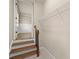 Hallway view leading to the bedroom, showcasing hardwood stairs and convenient closet storage at 541 Hickory Sw Dr, Marietta, GA 30064