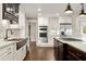 Gourmet kitchen featuring white cabinets, granite countertops, a copper sink and stainless steel appliances at 541 Hickory Sw Dr, Marietta, GA 30064