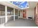 Cozy screened porch with a gray wood floor and outdoor access at 541 Hickory Sw Dr, Marietta, GA 30064