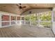 Inviting screened porch with wood ceiling and flooring, providing an ideal space for outdoor relaxation at 541 Hickory Sw Dr, Marietta, GA 30064