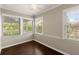 Sunroom with hardwood floors and multiple windows offering ample natural light and outdoor views at 541 Hickory Sw Dr, Marietta, GA 30064